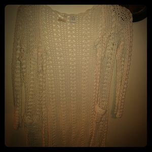 Long creme colored knit sweater